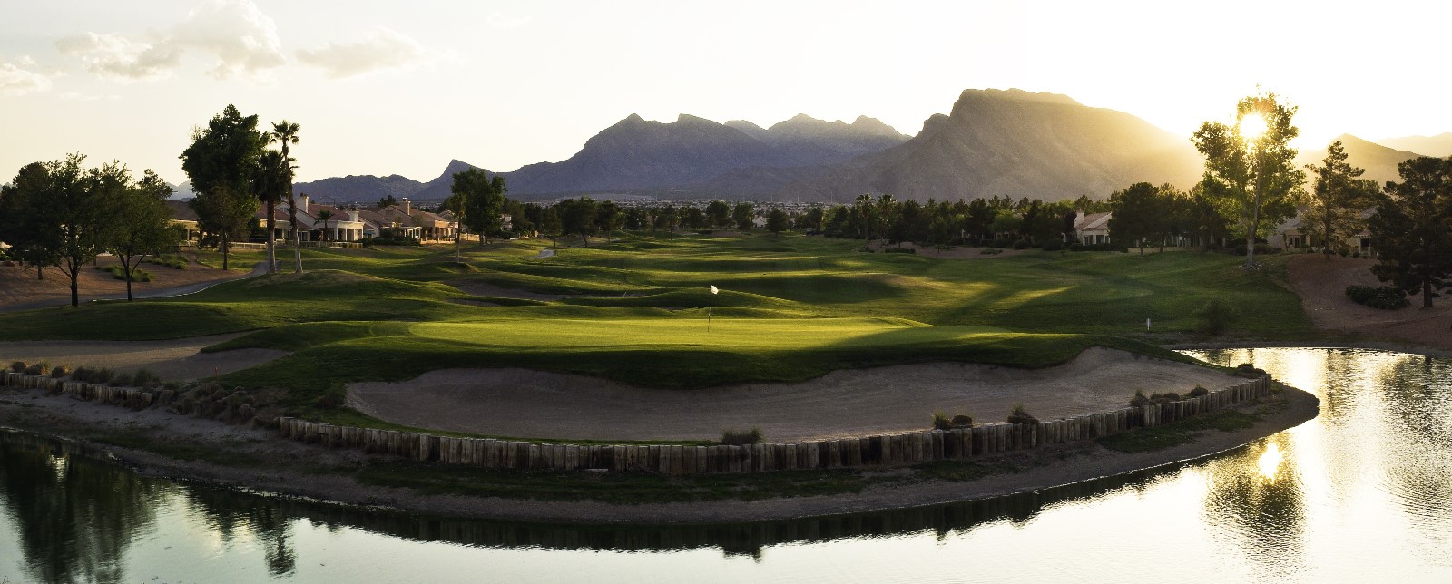 Image of golf ball on tee on grass.